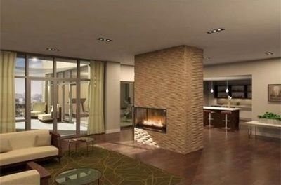 A living room with a fireplace and a couch