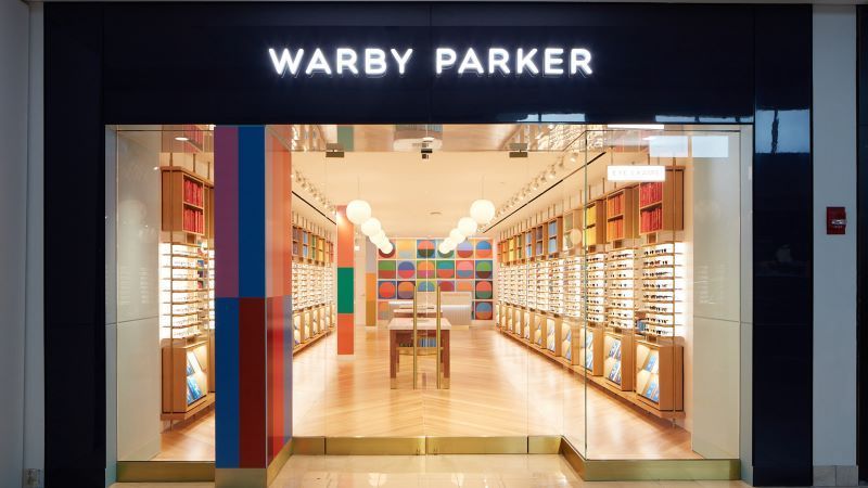 A warby parker store is located in a mall.