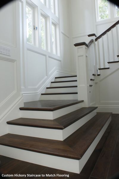 A picture of a custom hickory staircase to match flooring