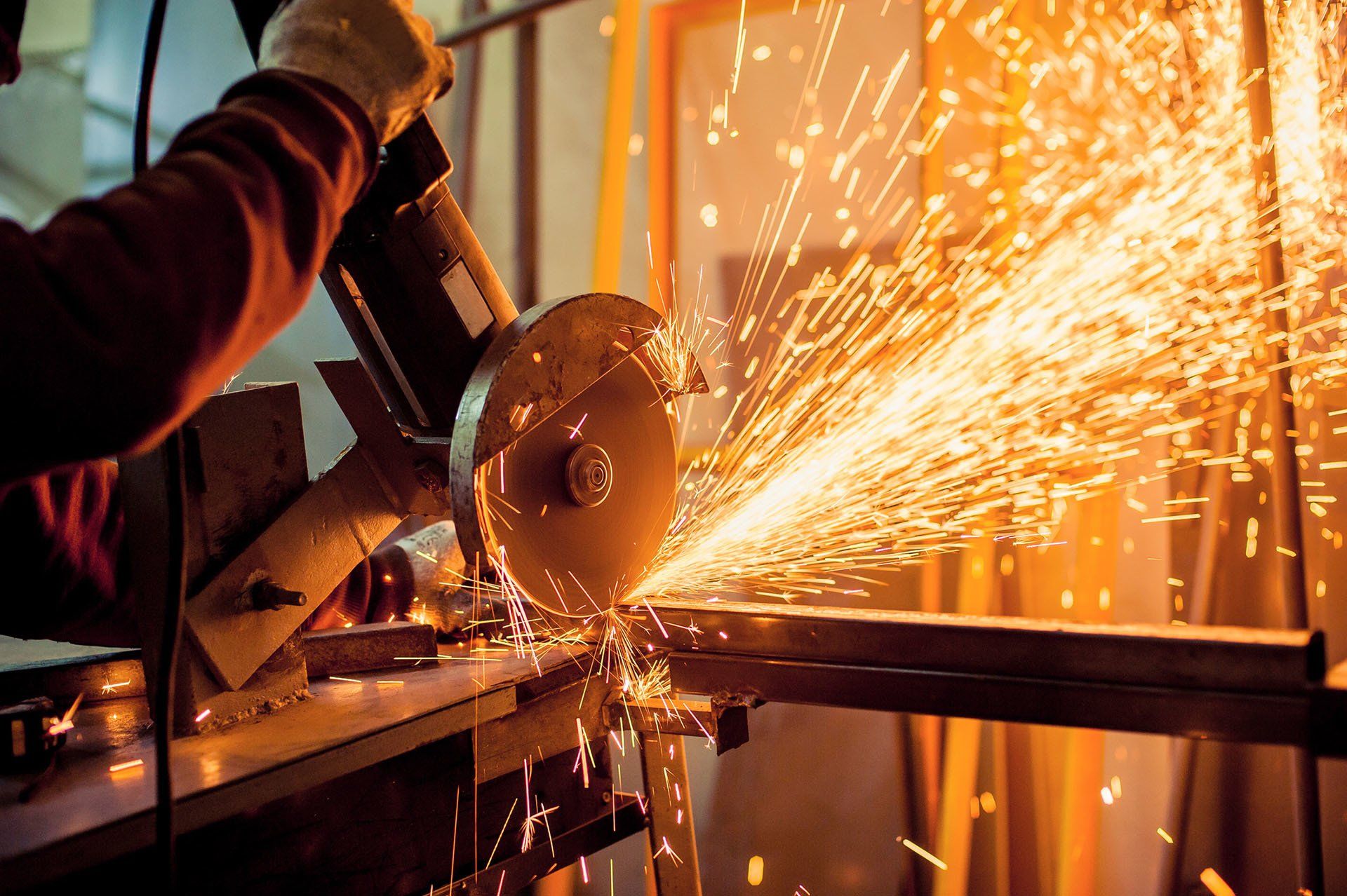 Man Working with Electric Grinder — Suffolk, VA — Suffolk Iron Works