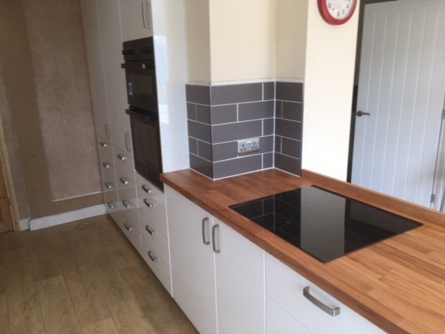 Dark grey kitchen tiles with worktop