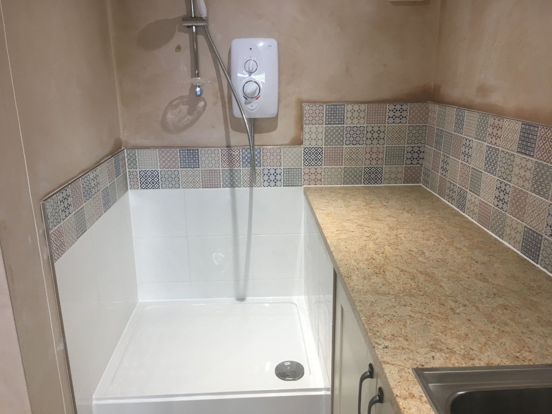 A shower in a utility room
