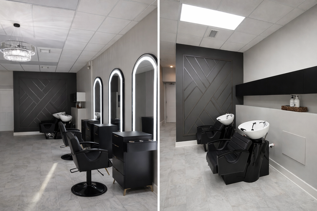 Split view of a modern hair salon featuring gray tile, black chairs, illuminated arched mirrors, and geometric wall art.