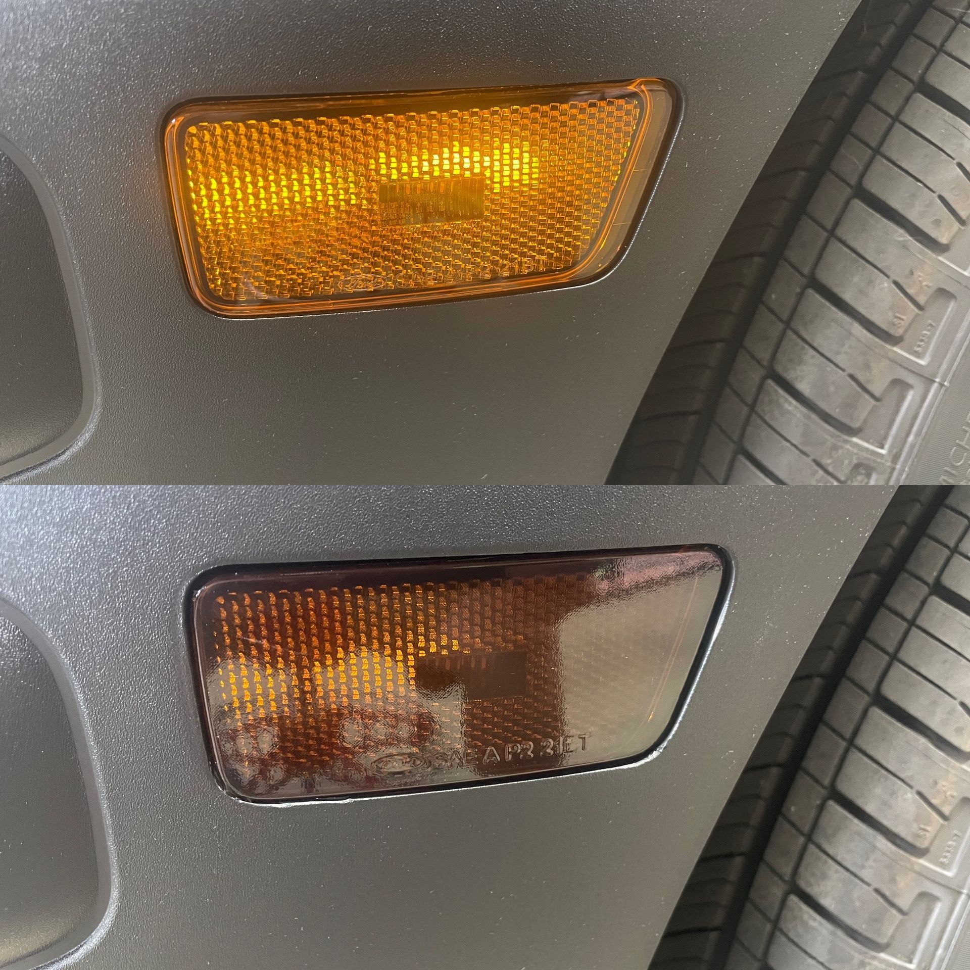 A truck is parked in a garage under a sign that says volt