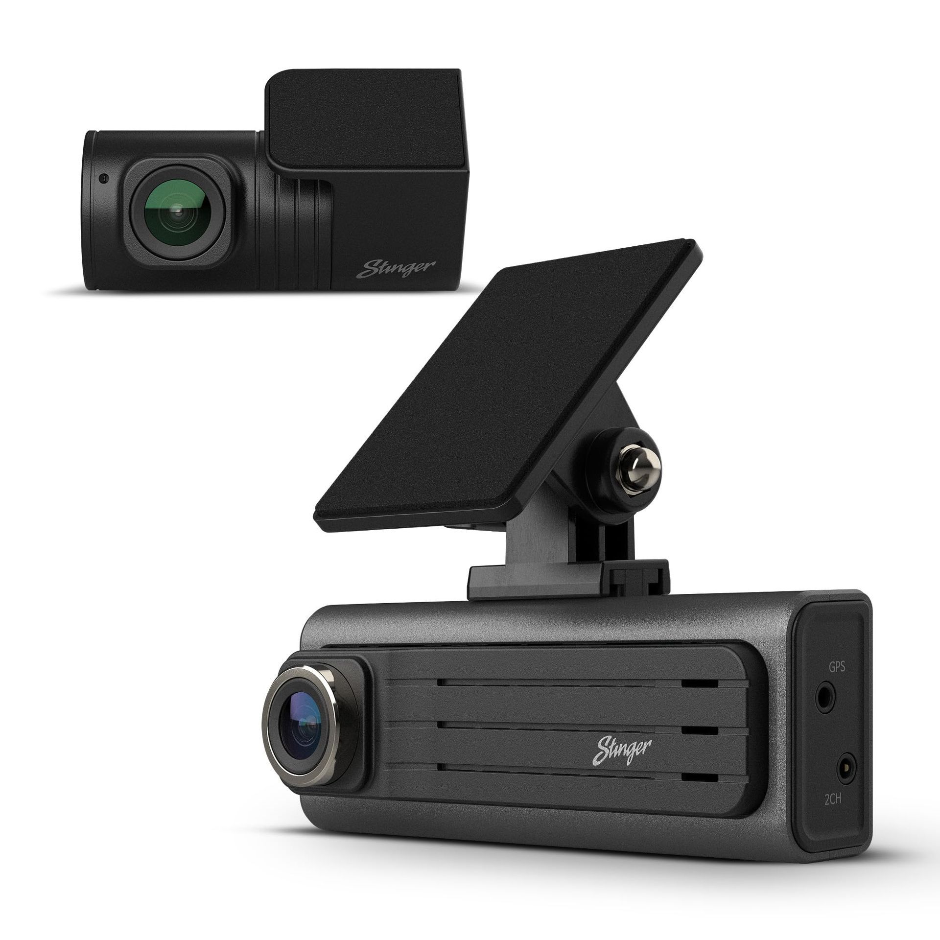 A dash cam is sitting on top of a white surface.