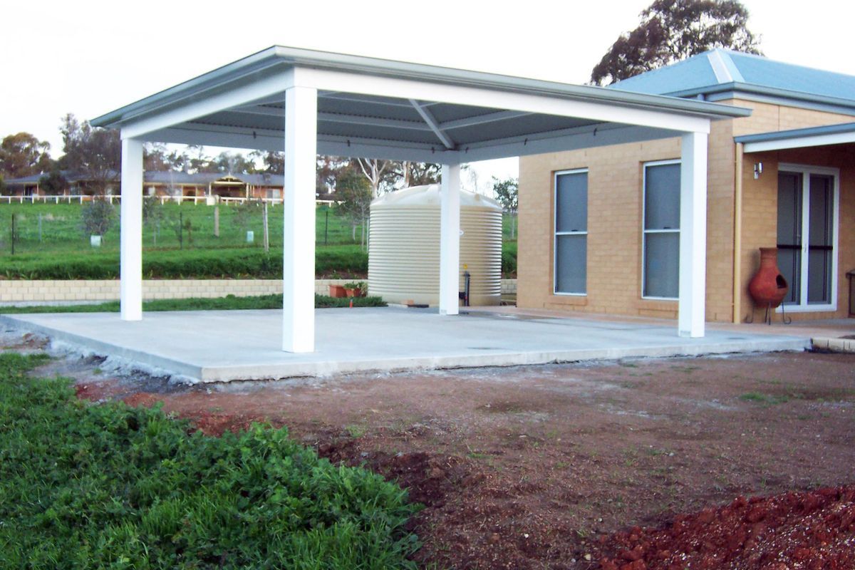 A White-pillared Metal Carport Structure Stands Over a Concrete Pad — The Gazebo and Shade Centre in Jindera, NSW