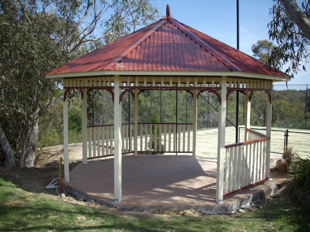 An Octagonal Gazebo With a Red Corrugated Roof — The Gazebo and Shade Centre in Jindera, NSW