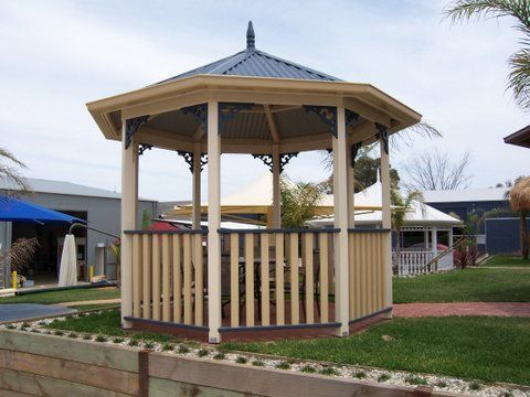 Octagonal Beige Gazebo With a Dark Blue Roof — The Gazebo and Shade Centre in Wangaratta, VIC
