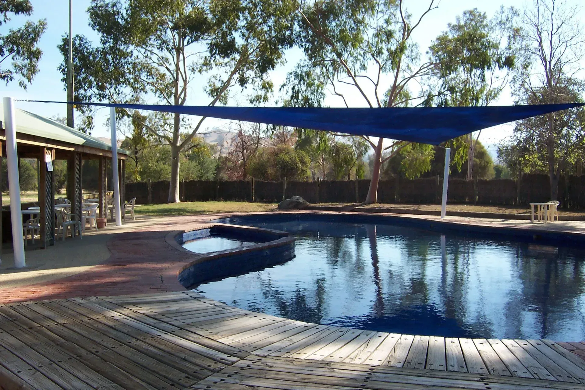 Swimming Pool With Blue Shade Sail, Gazebo — The Gazebo and Shade Centre in Jindera, NSW