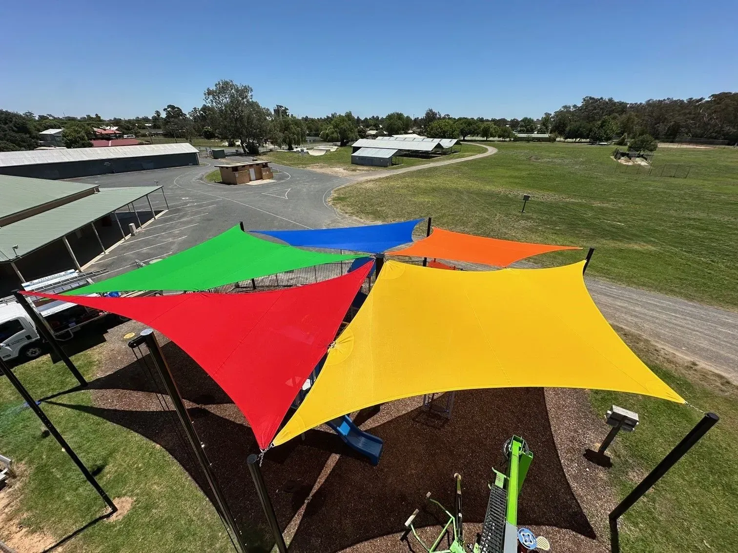 Outdoor Seating Area With White Umbrellas — The Gazebo and Shade Centre in Jindera, NSW