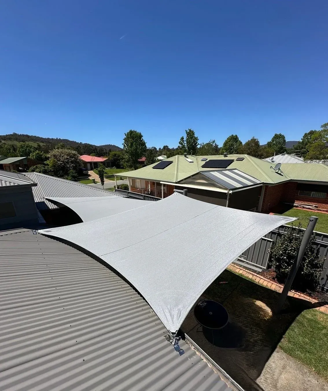 Grey Shade Sail Over Corrugated Roof — The Gazebo and Shade Centre in Jindera, NSW
