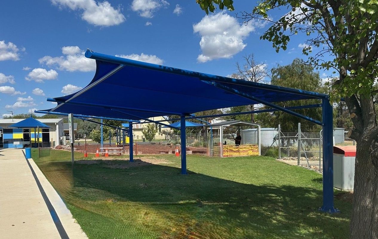 A Large Blue Shade Structure Stands Over a Grassy Lawn — The Gazebo and Shade Centre in Jindera, NSW