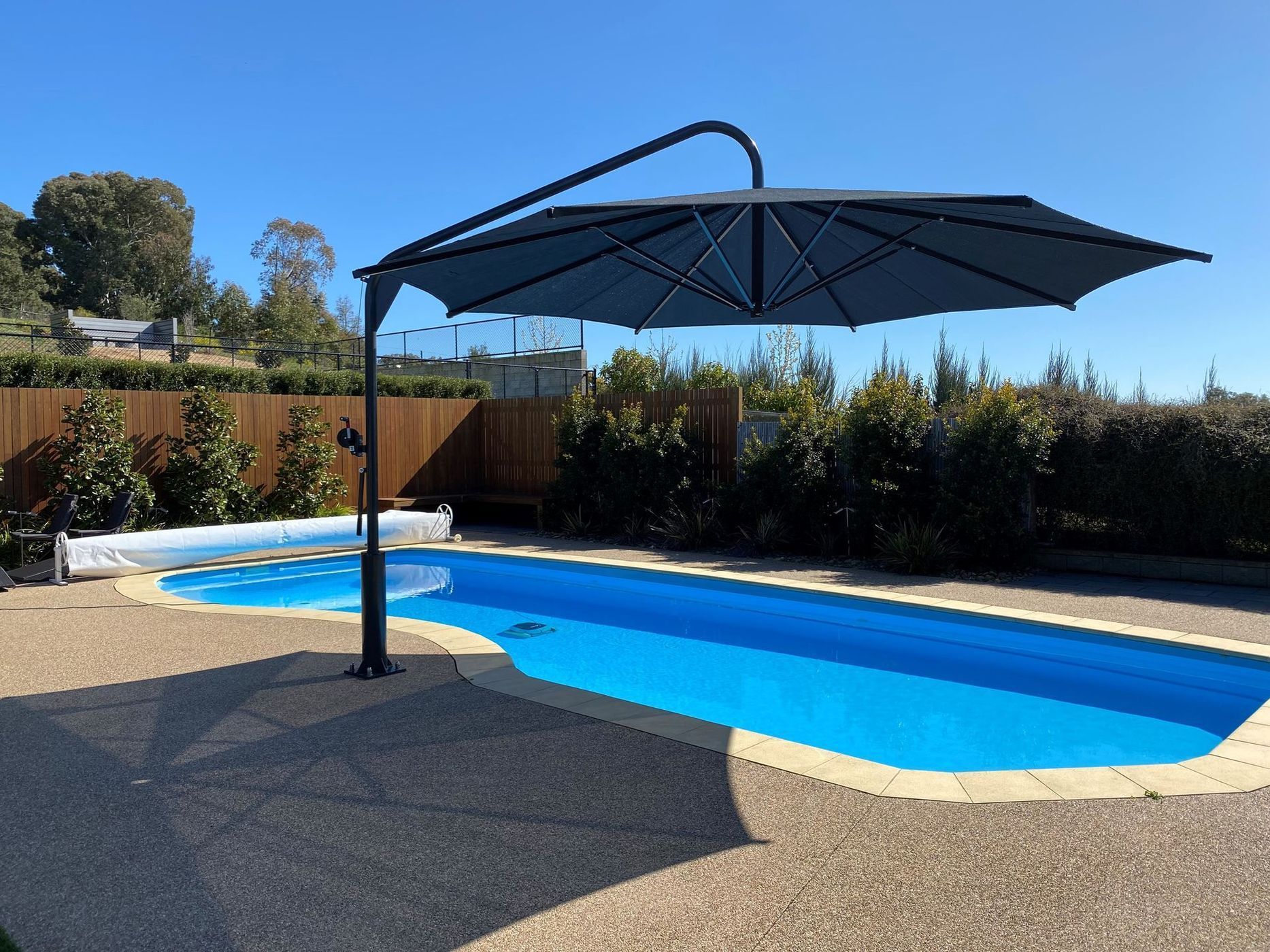 Cantilever Umbrella Shades a Blue Pool — The Gazebo and Shade Centre in Jindera, NSW