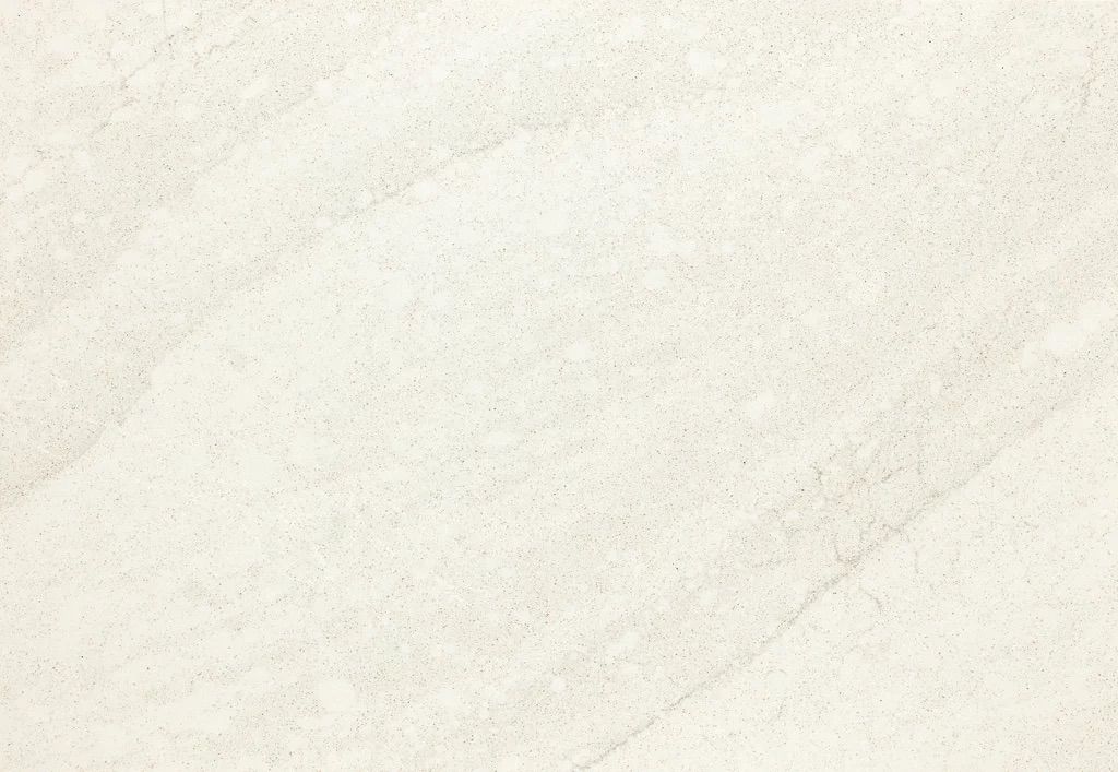 Cream-colored wall with diagonal markings suggesting texture or wear.