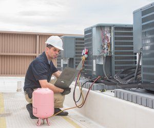 Air Conditioning Repair — HVAC Technician with Panel in Charlottesville, VA