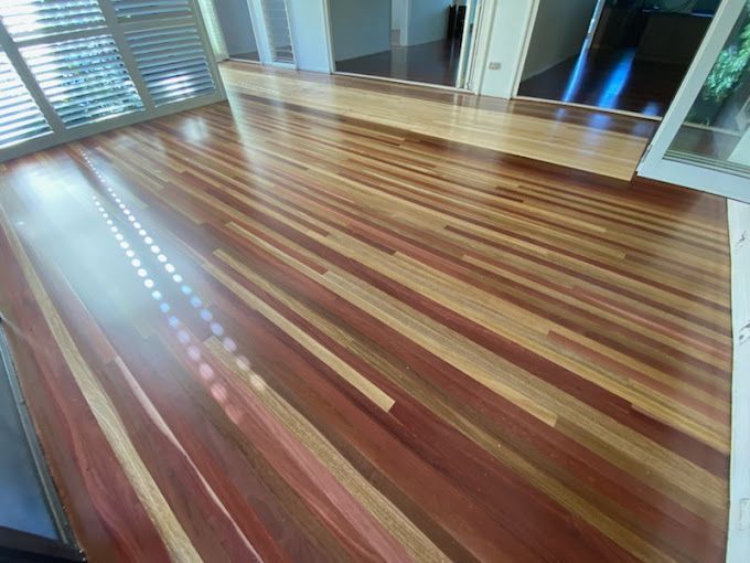 A Room With A Wooden Floor And Windows — Dale Dow Floor Sanding In Kirwan, QLD