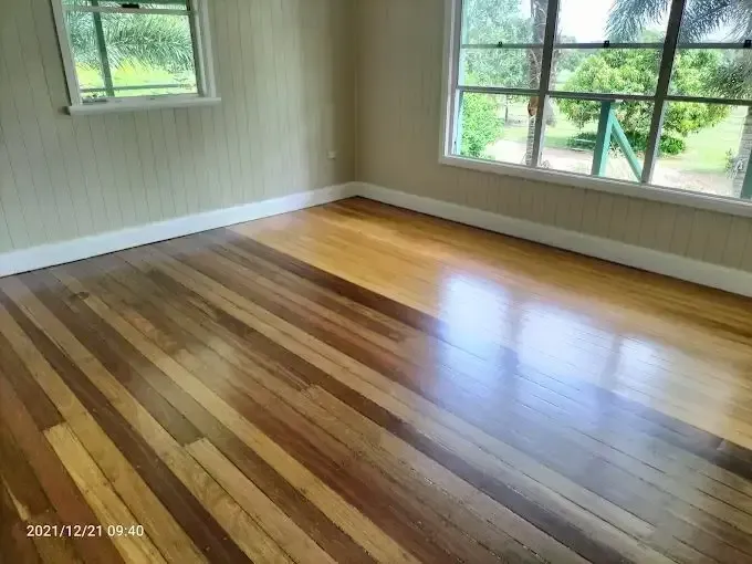A Room With A Wooden Floor And Two Windows — Dale Dow Floor Sanding In Kirwan, QLD