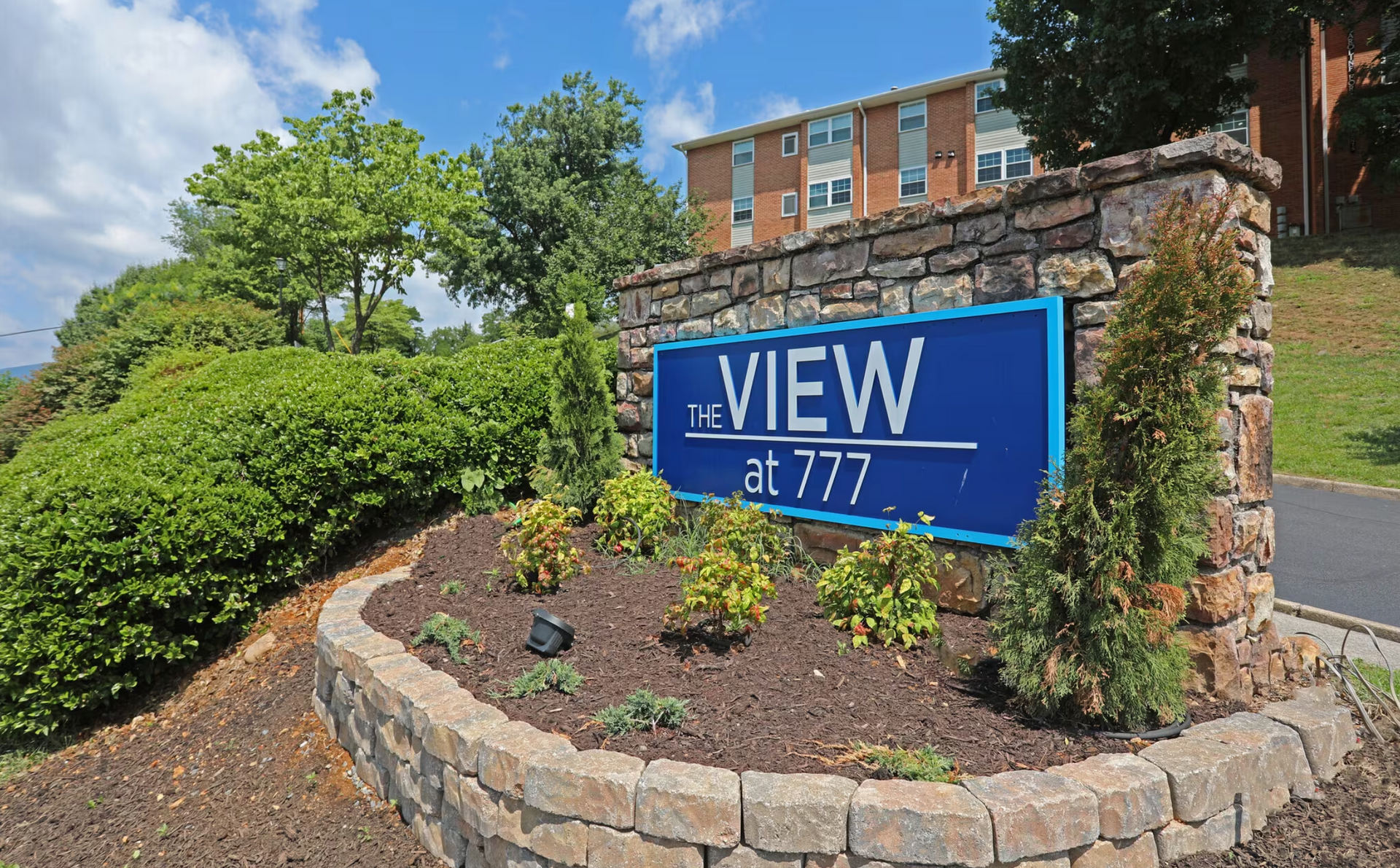 A blue sign that says View at 777 on it.