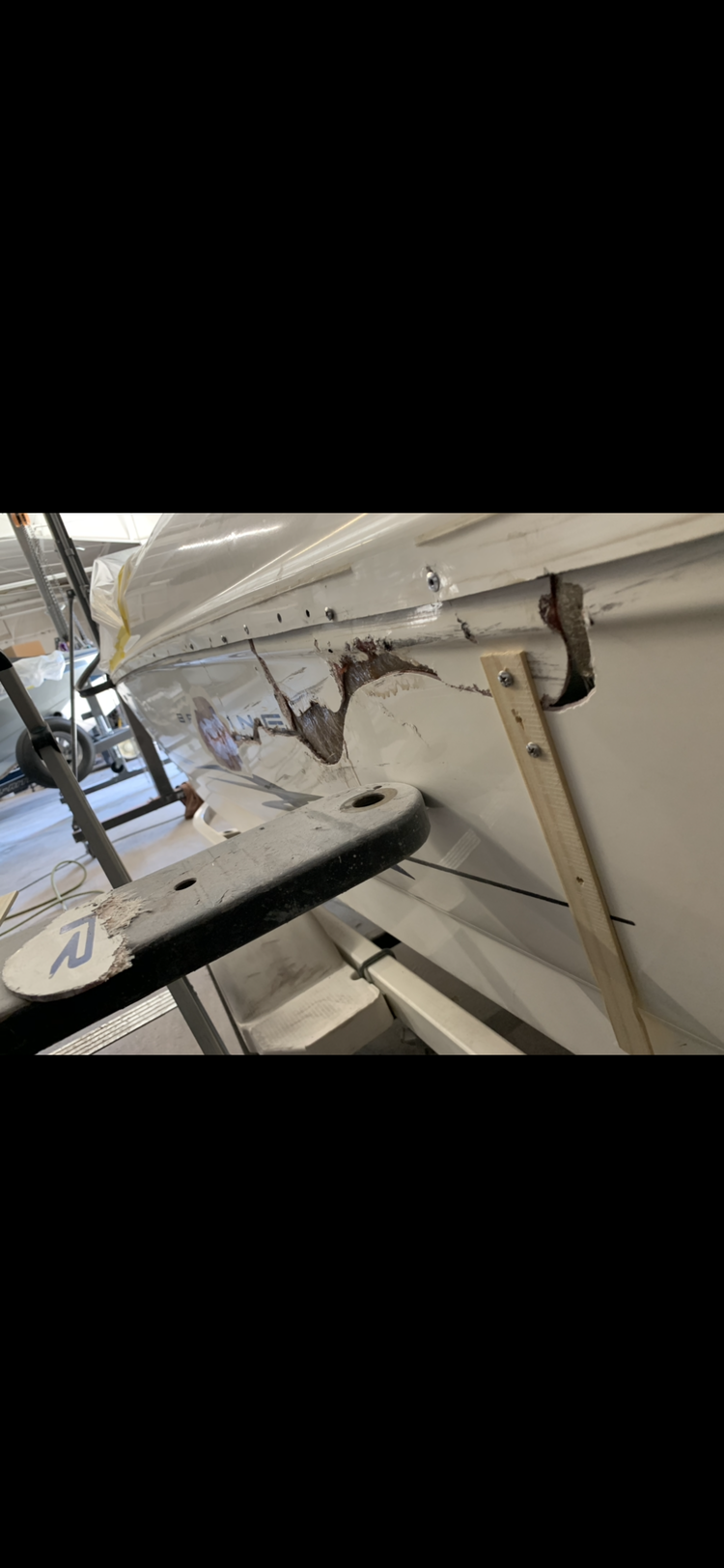 A close up of a boat in a garage.