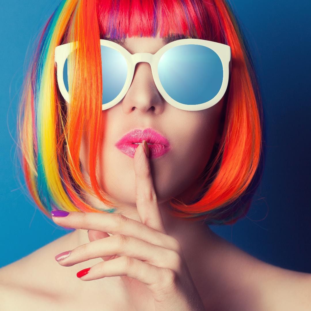 Woman with colorful hair wearing glasses