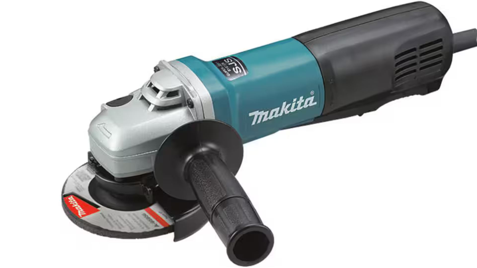 A man is using a chainsaw to cut a piece of wood.