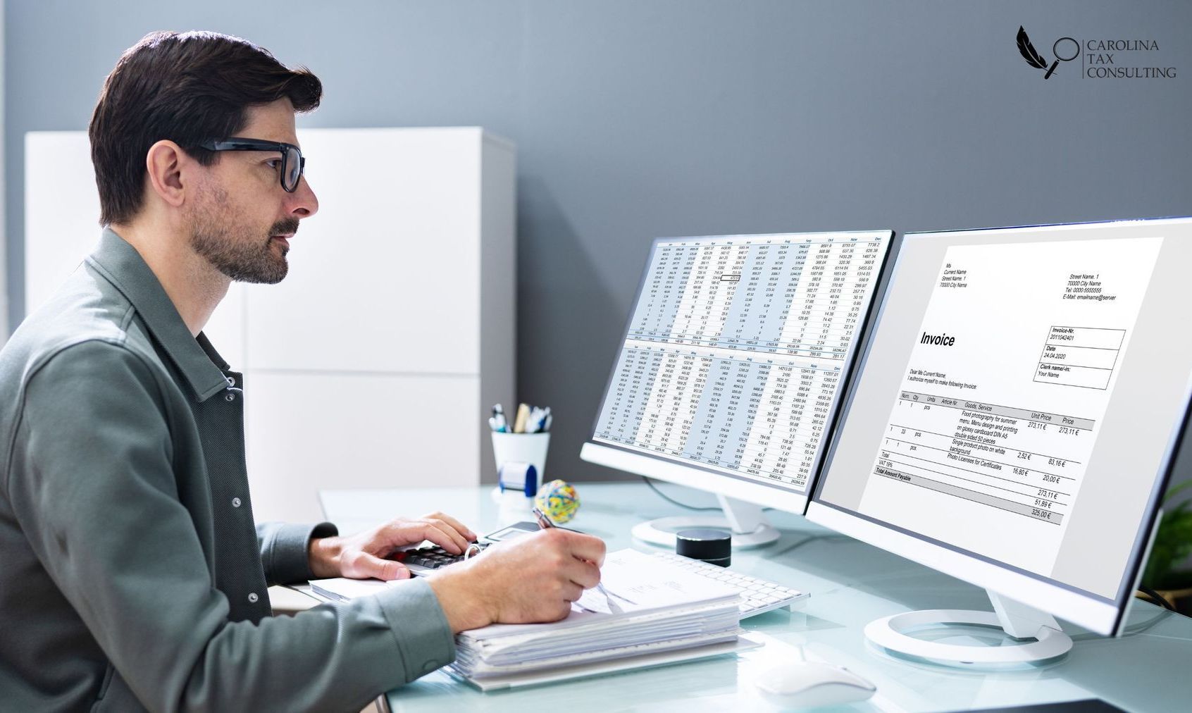 A man sitting at a desk with a computer
