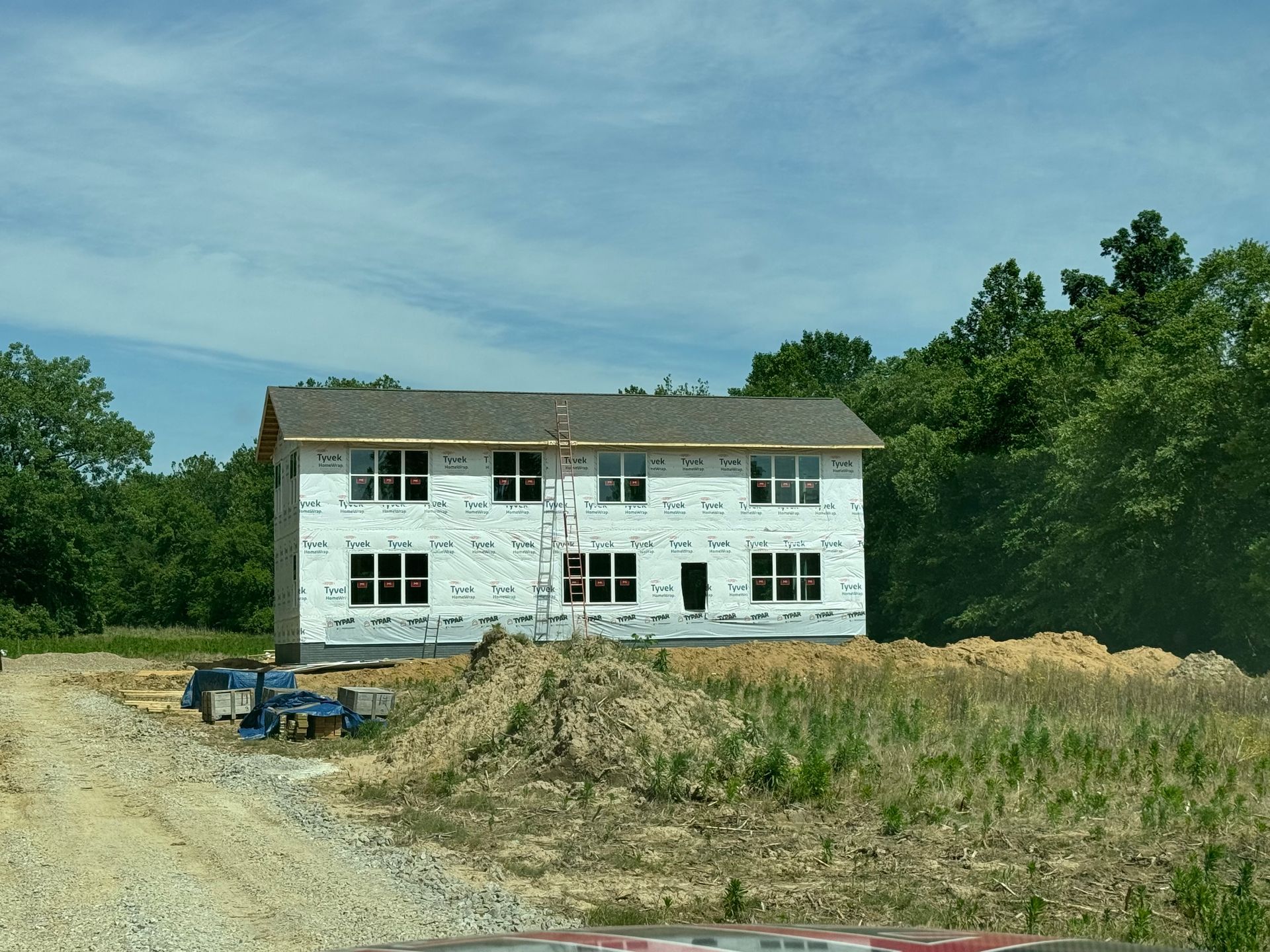 A house that is being built in a field
