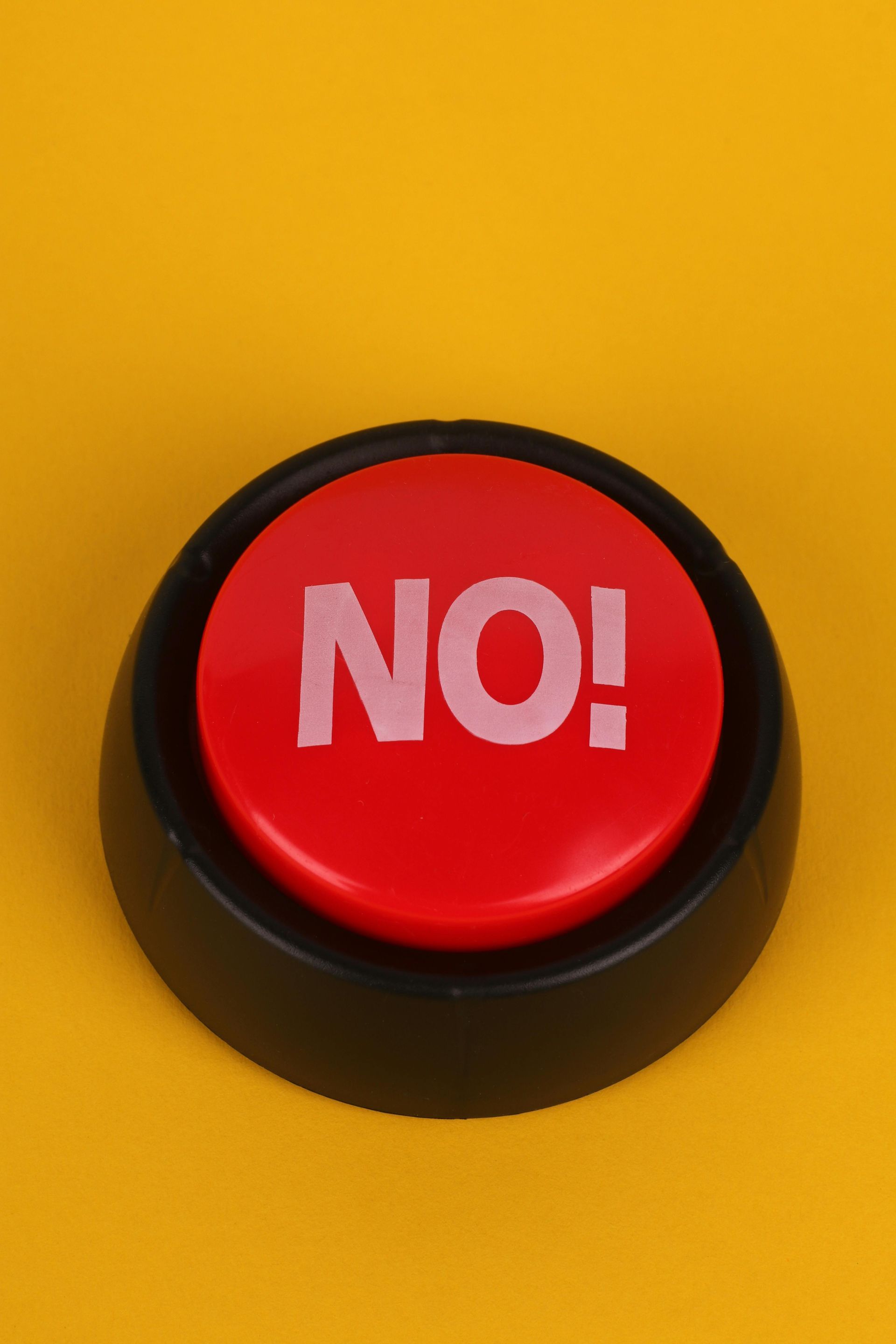 A red button with the word no written on it