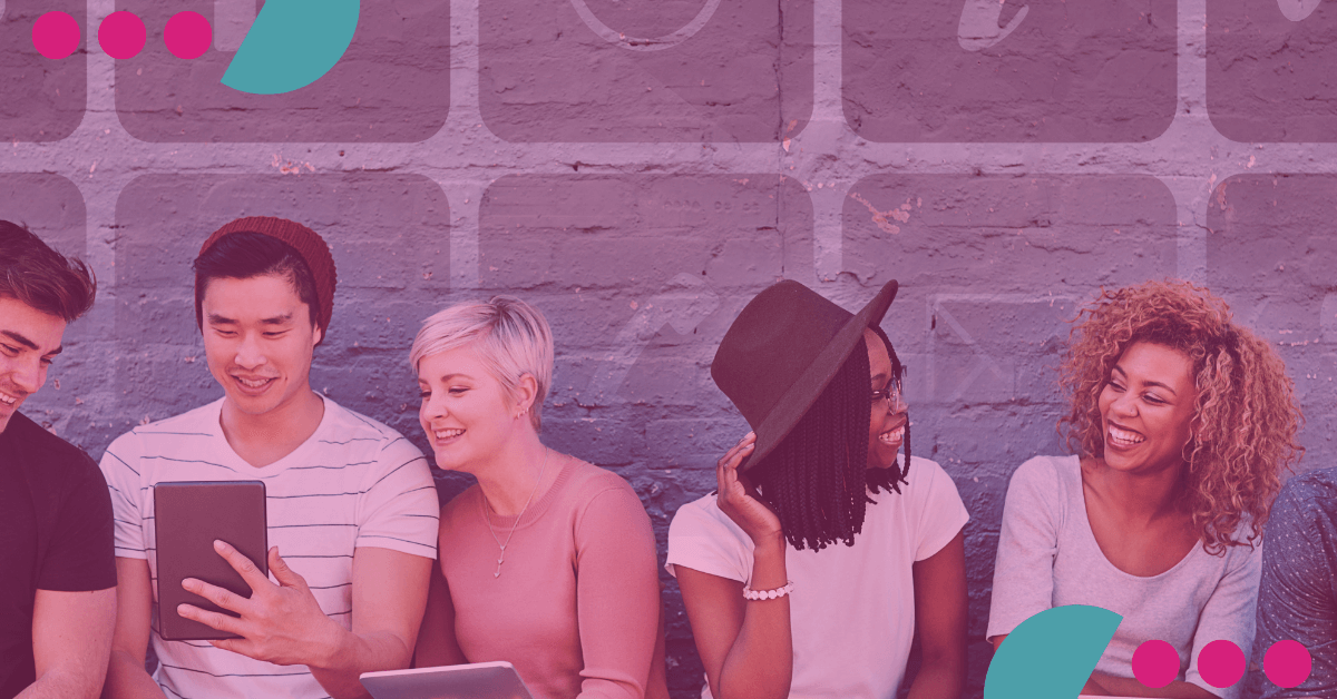 A group of young people are sitting next to each other in front of a brick wall. Gamificação