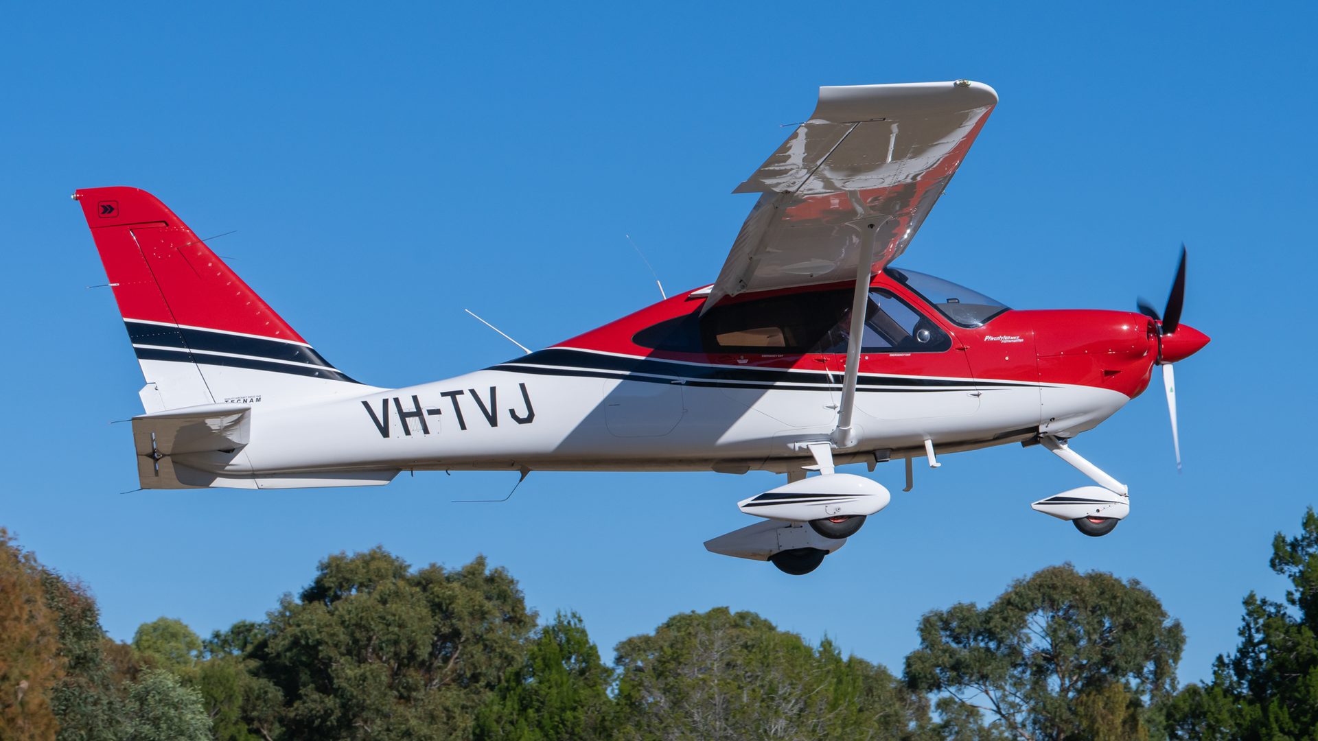 A small plane with the letters vh-tvj on the side