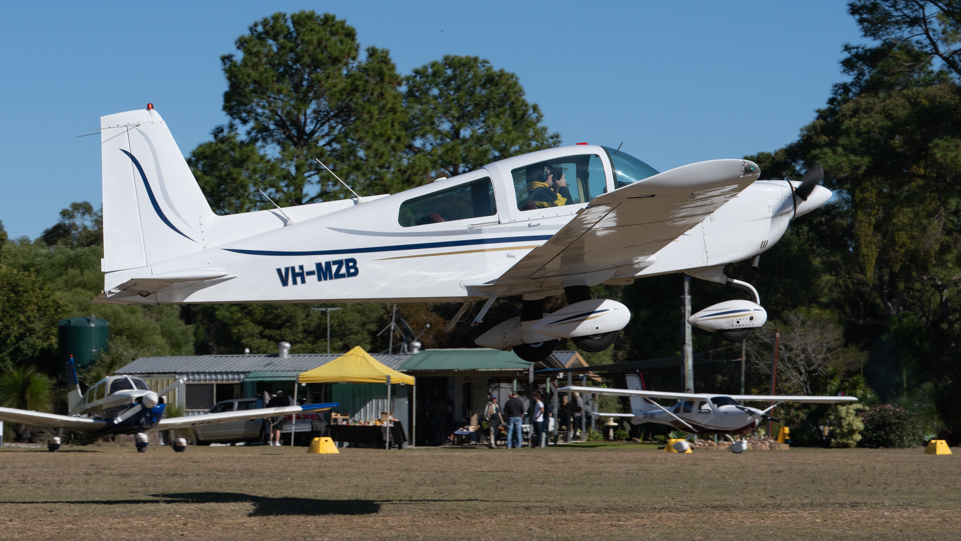 A small plane with the letters vh-mzd on the side of it
