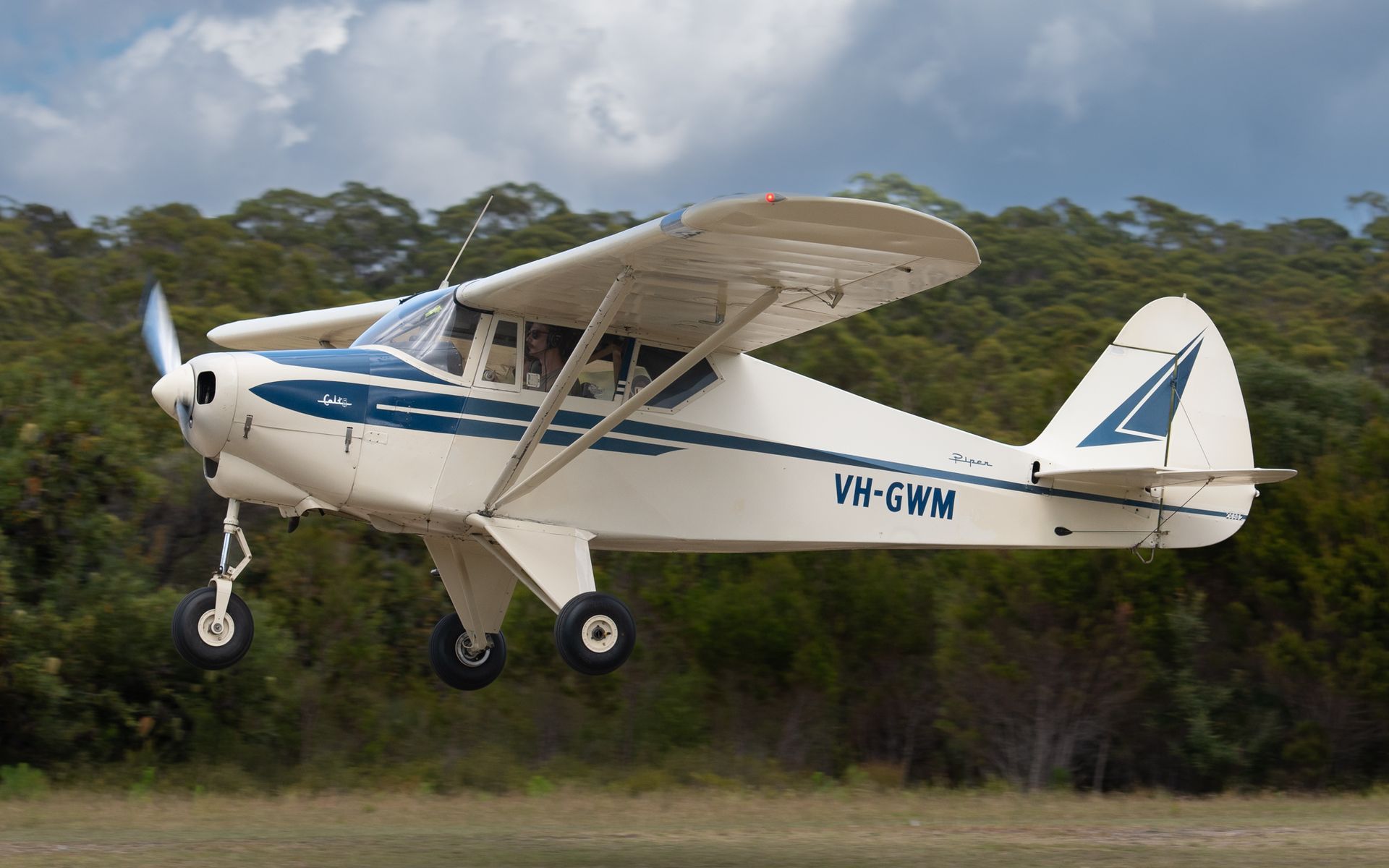 a small plane with the letters vh-gwm on the side