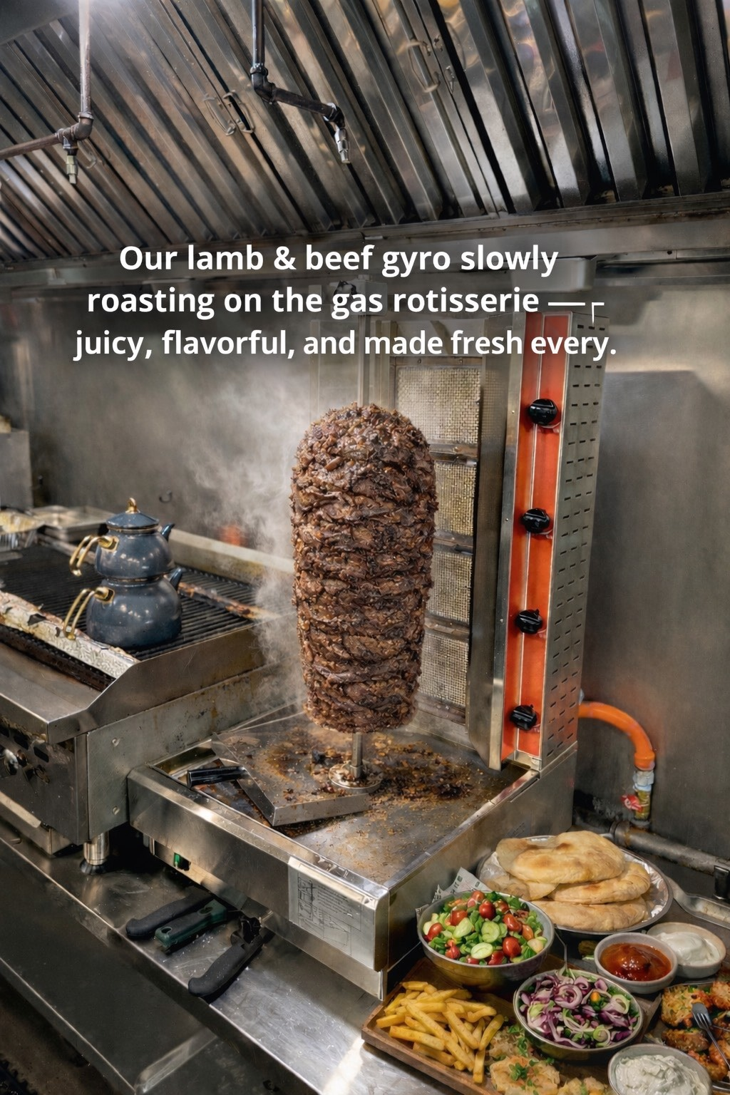 Lamb and beef gyro roasting on a gas rotisserie, with fresh ingredients and text description.