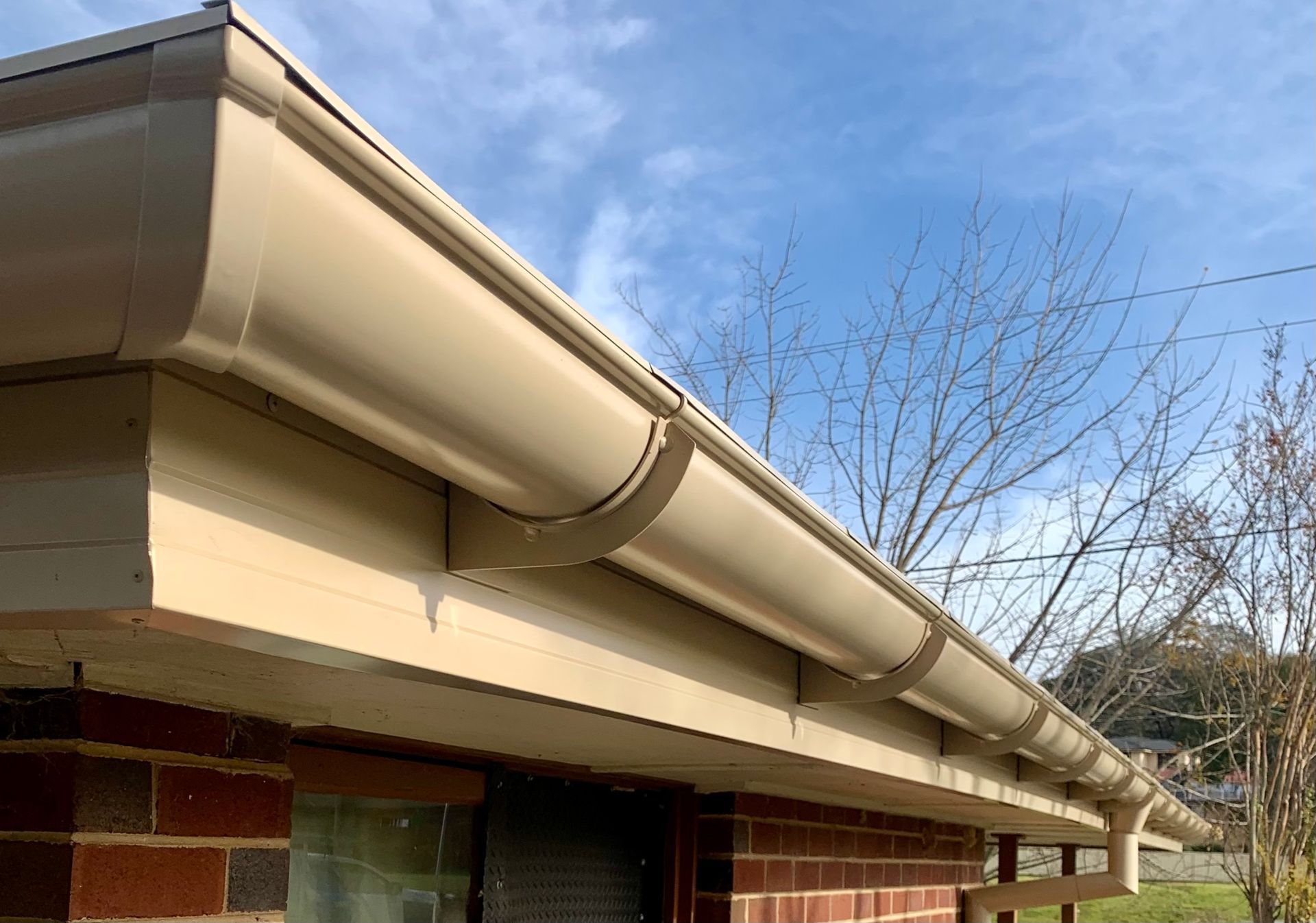 Close Up of a cream coloured gutter — Essential Roofing and Plumbing in Wagga Wagga, NSW
