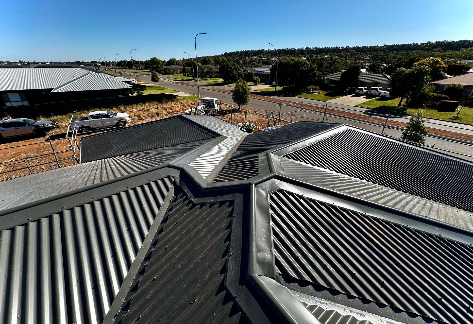 Close up of a dark metal roof — Essential Roofing and Plumbing in Wagga Wagga, NSW