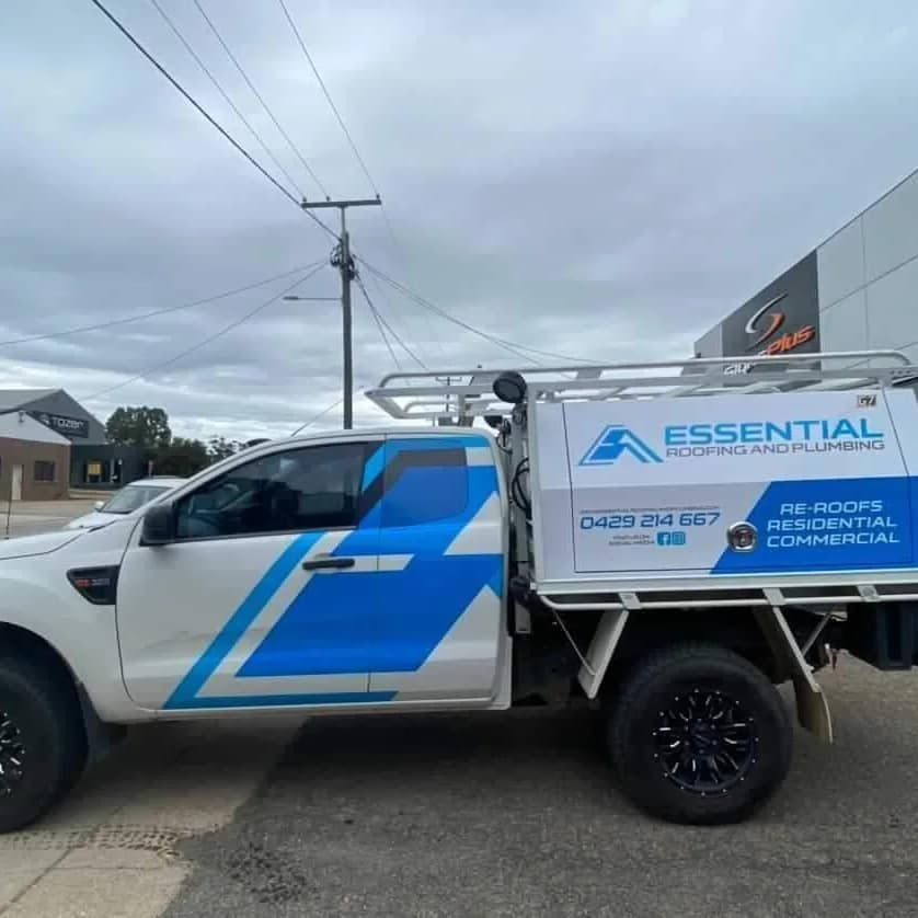 A White and Blue Truck With Essential Written on the Side — Essential Roofing and Plumbing in Cootamundra, NSW