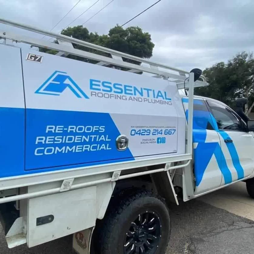An Essential Roofing and Plumbing Truck Parked on the Side of the Road — Essential Roofing and Plumbing in Wagga Wagga, NSW