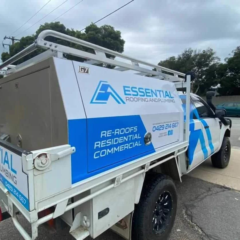 An Essential Roofing and Plumbing Truck is Parked on the Side of the Road — Essential Roofing and Plumbing in Narrandera, NSW