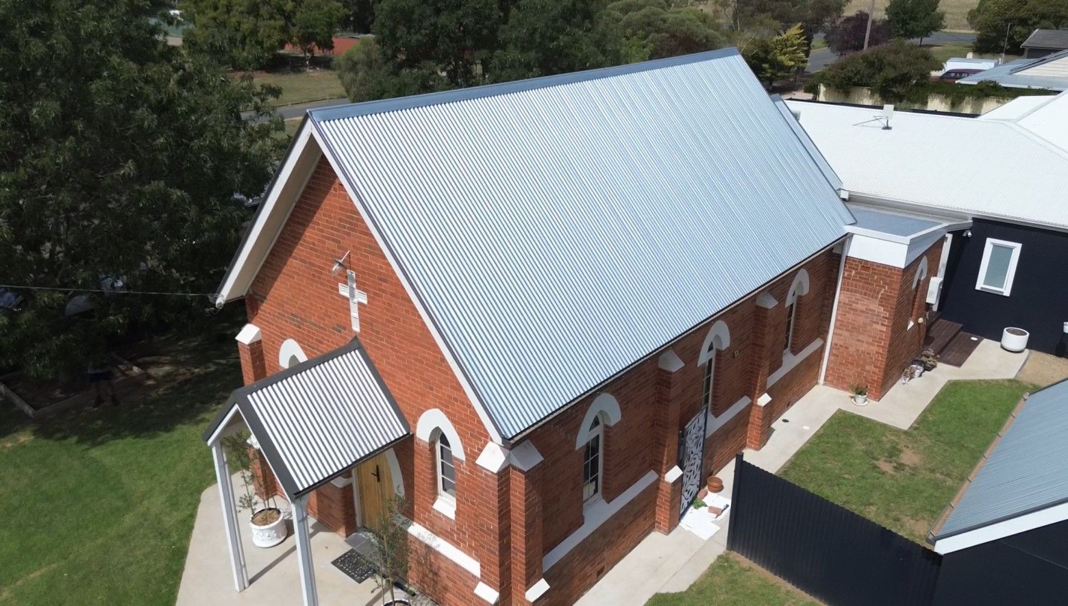 A church with a metal roof — Essential Roofing and Plumbing in Wagga Wagga, NSW