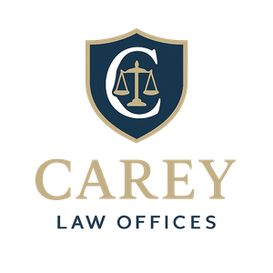 Logo for Carey Law Offices: Navy and gold shield with a "C" and scales of justice above "Carey Law Offices".