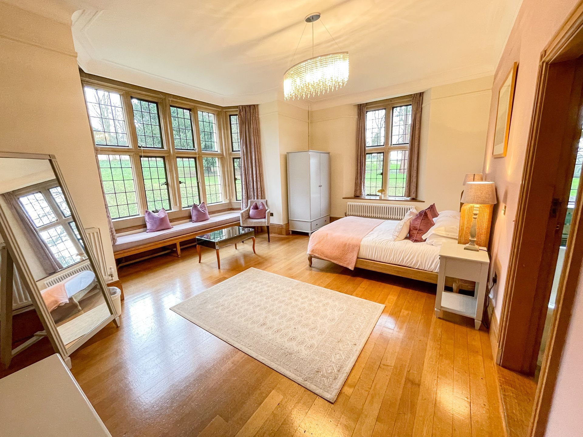 There is a large bed in the middle of the room.