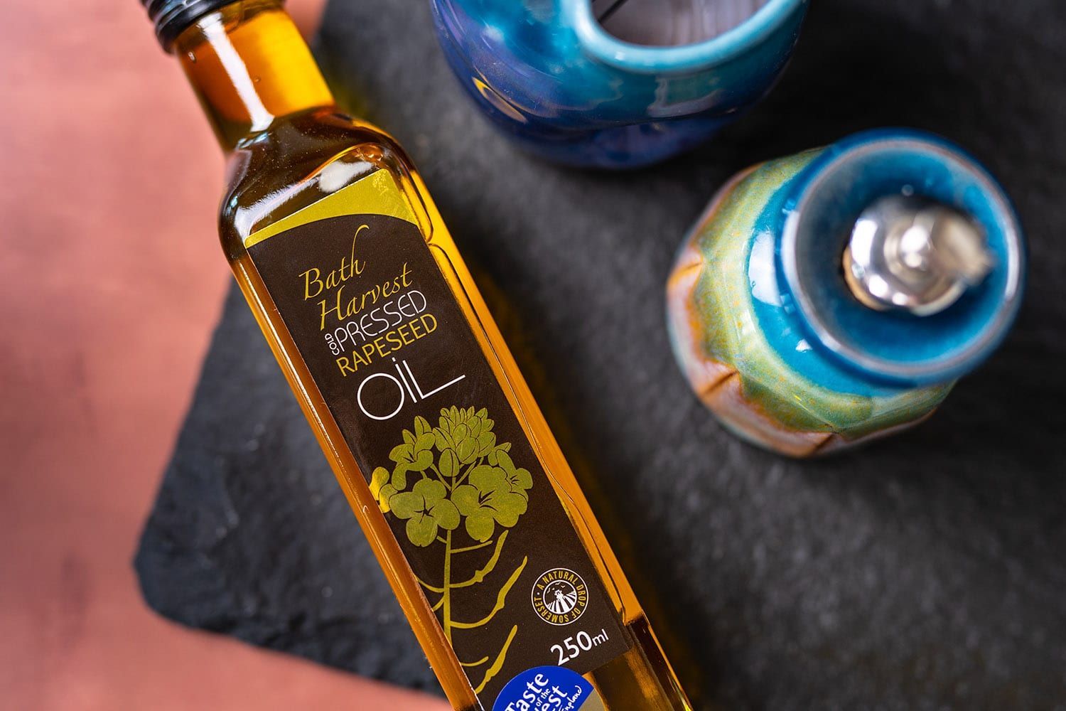 A bottle of rapeseed oil is sitting on a table