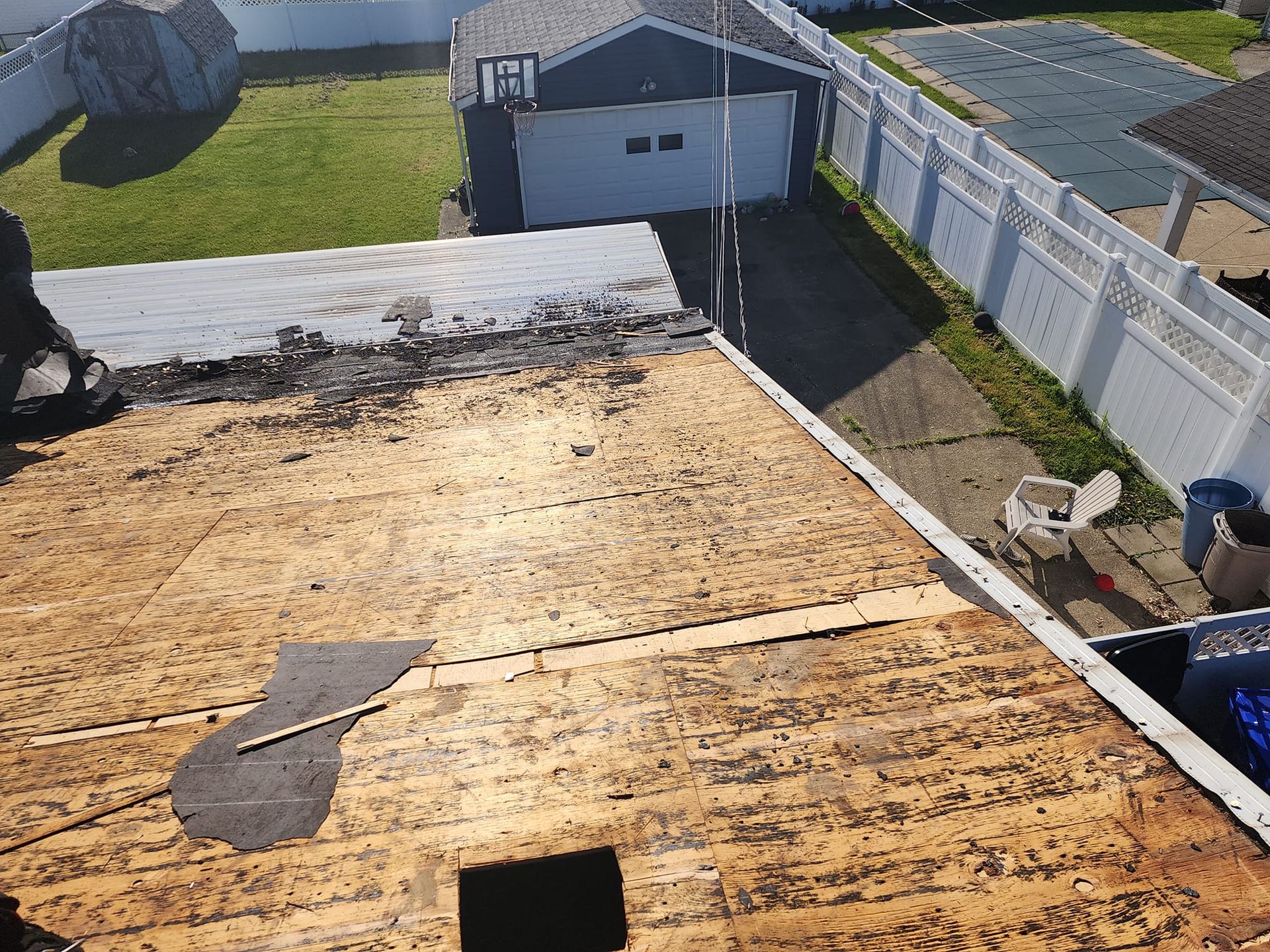 An aerial view of a roof that is being repaired.