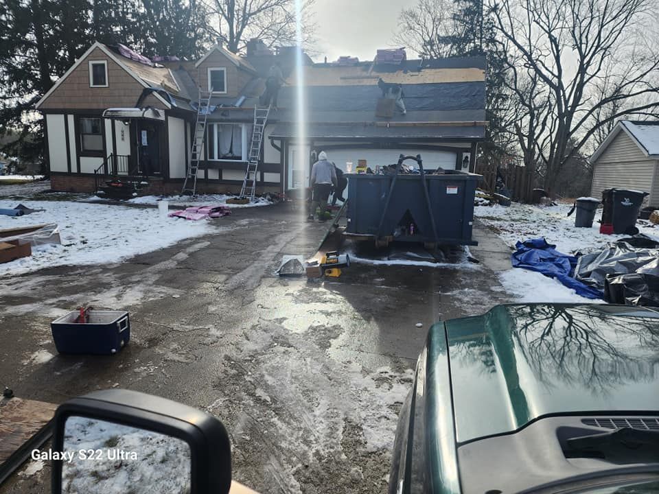 A truck is parked in front of a house that is being remodeled.
