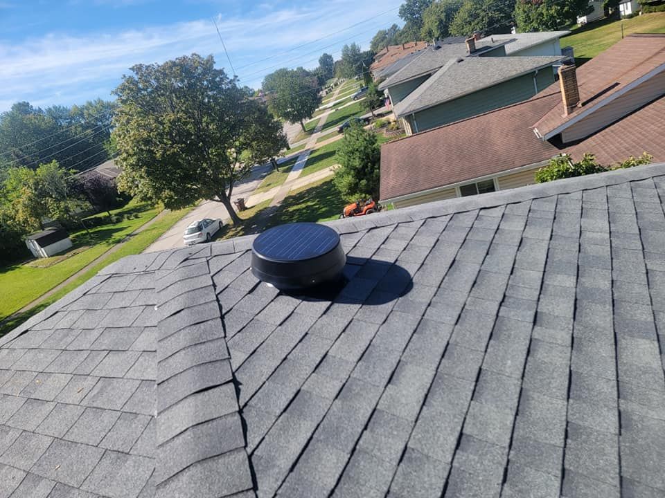 An aerial view of a roof with a chimney on top of it.