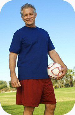 Man Holding A Ball — Clinton, TN — Premier Weight Management & Aestheics, LLC