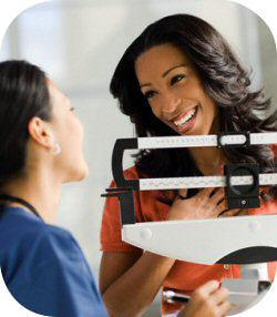 Woman Stepping On Weigh Scales — Clinton, TN — Premier Weight Management & Aestheics, LLC