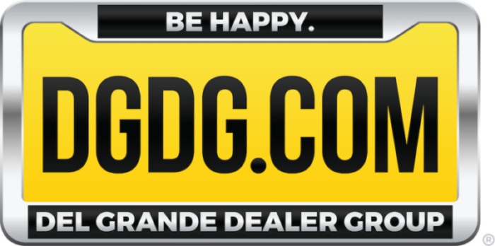 a yellow sign that says dgdg.com del grande dealer group