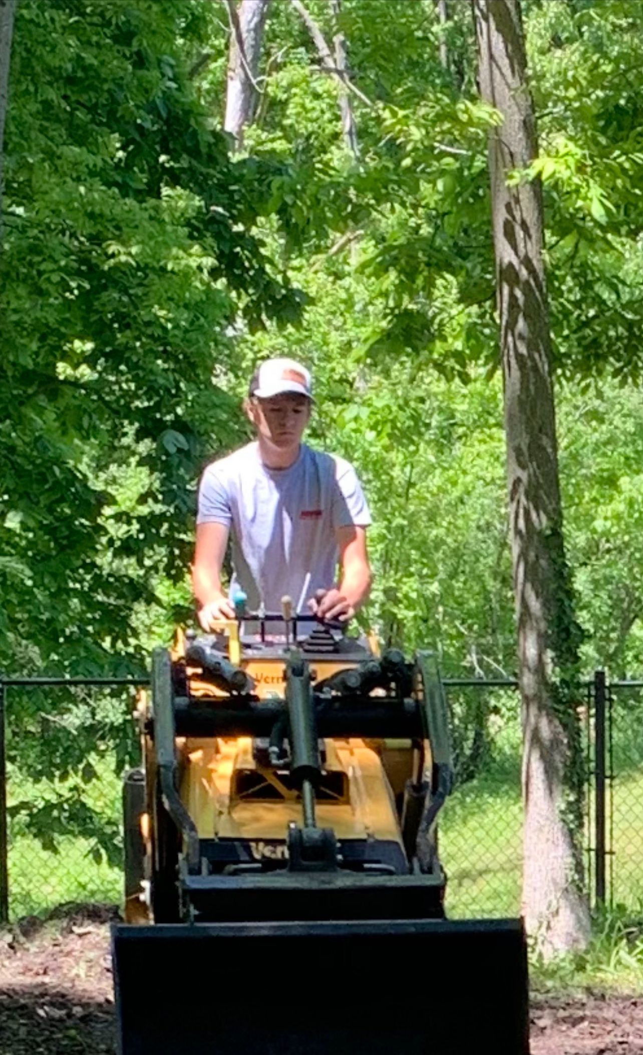 Man is Riding a Tractor in the Woods