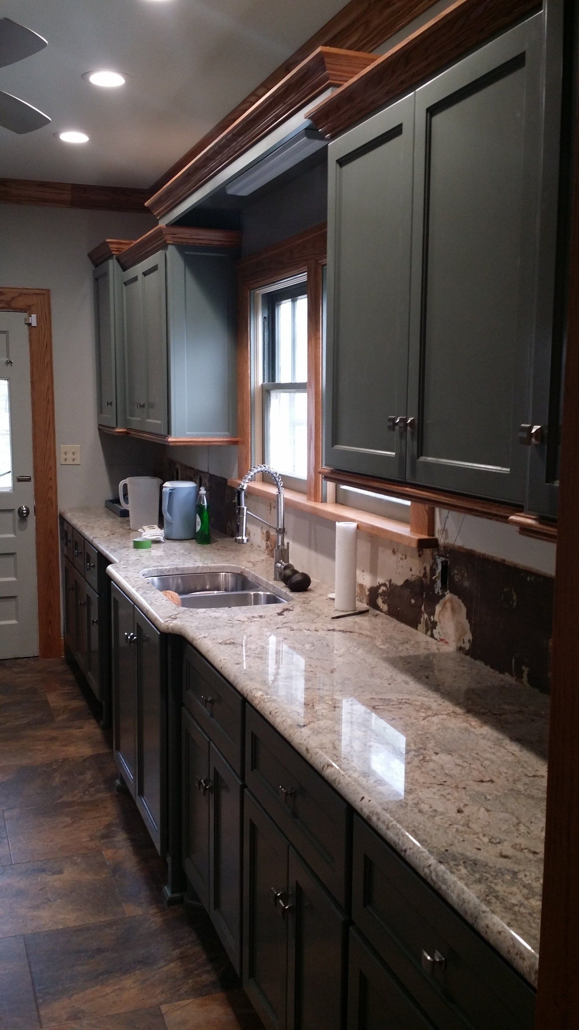 Interior bathroom remodeling job with new tub and marble sink countertop